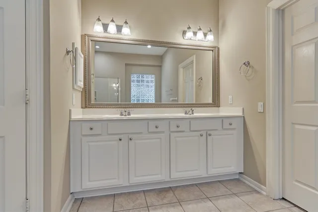 a spacious bathroom with a bathtub and a shower