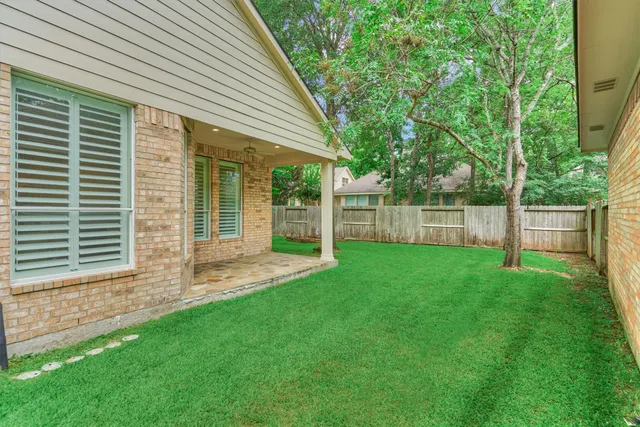 a garden with wooden fence