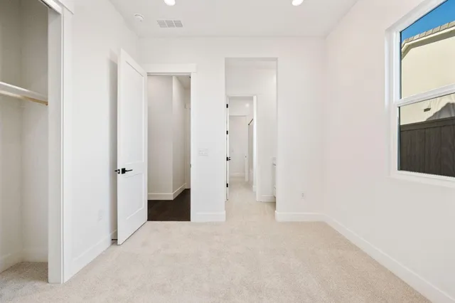 a view of empty room with closet