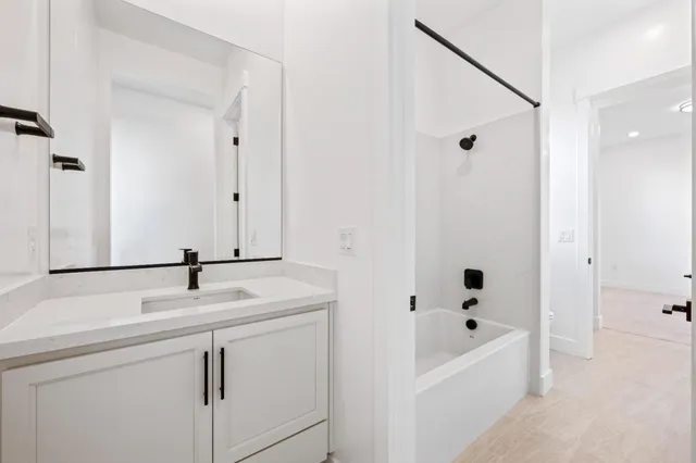 a bathroom with a sink and a bathtub