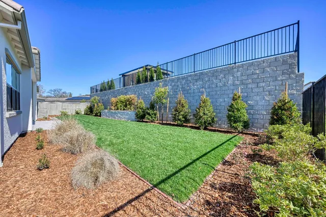 a view of a back yard of the house
