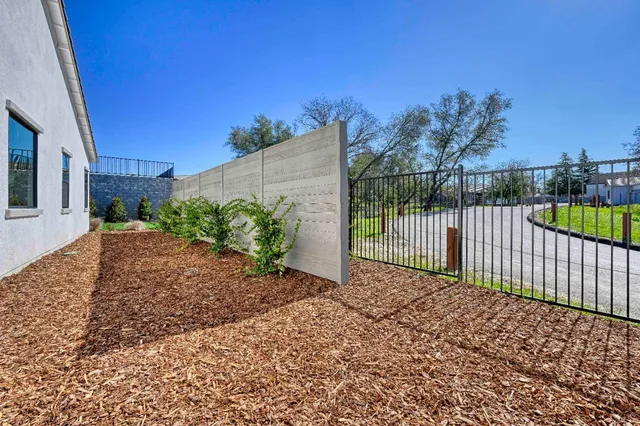 a view of a backyard with a garden