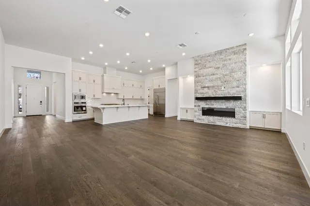 a view of kitchen with kitchen island wooden cabinets and stainless steel appliances