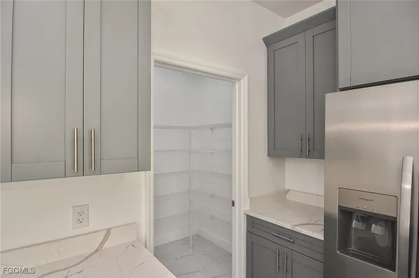 a bathroom with a shower and a sink