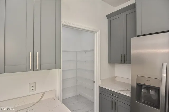 a bathroom with a shower and a sink