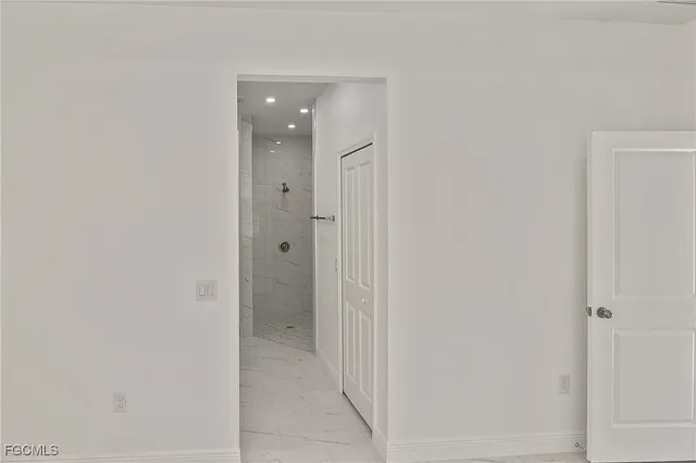 a view of a hallway with a door
