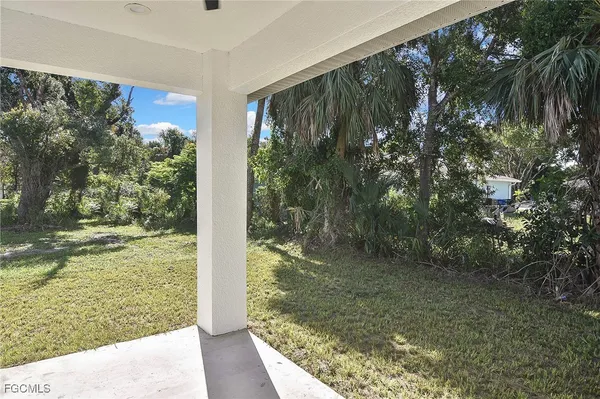 a view of a back yard from a balcony