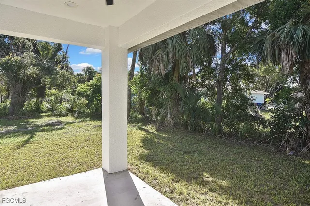 a view of a back yard from a balcony