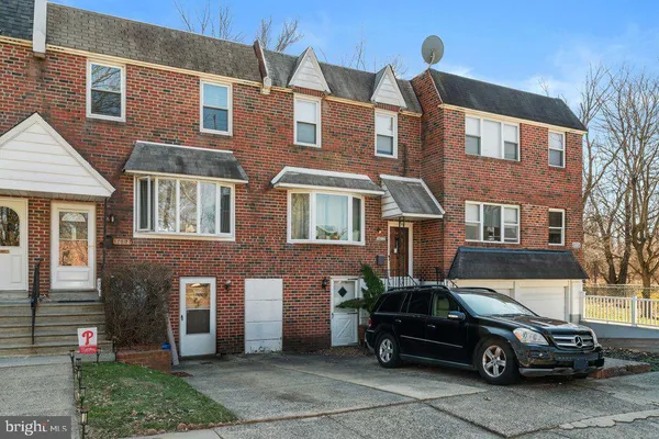 a car parked in front of a house