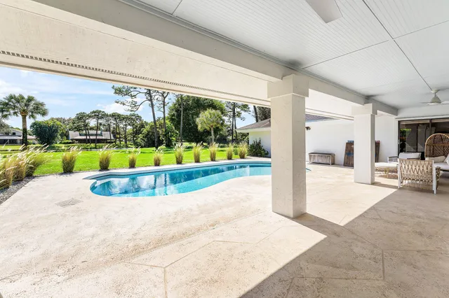 a view of a swimming pool and a yard