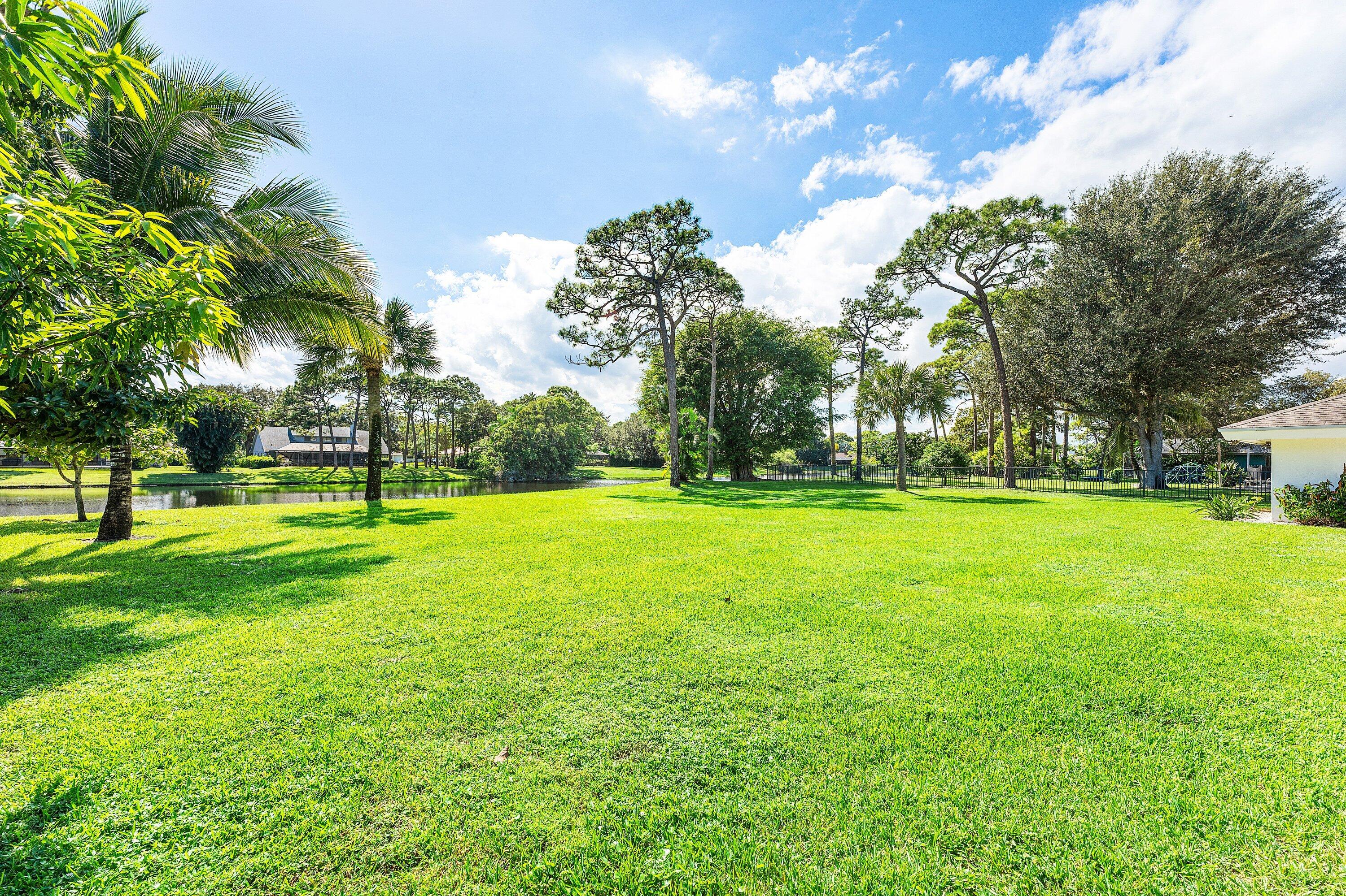 6048 Wood Lake Road Jupiter, FL 33458 - Photo 27 of 31 a view of a park with large trees
