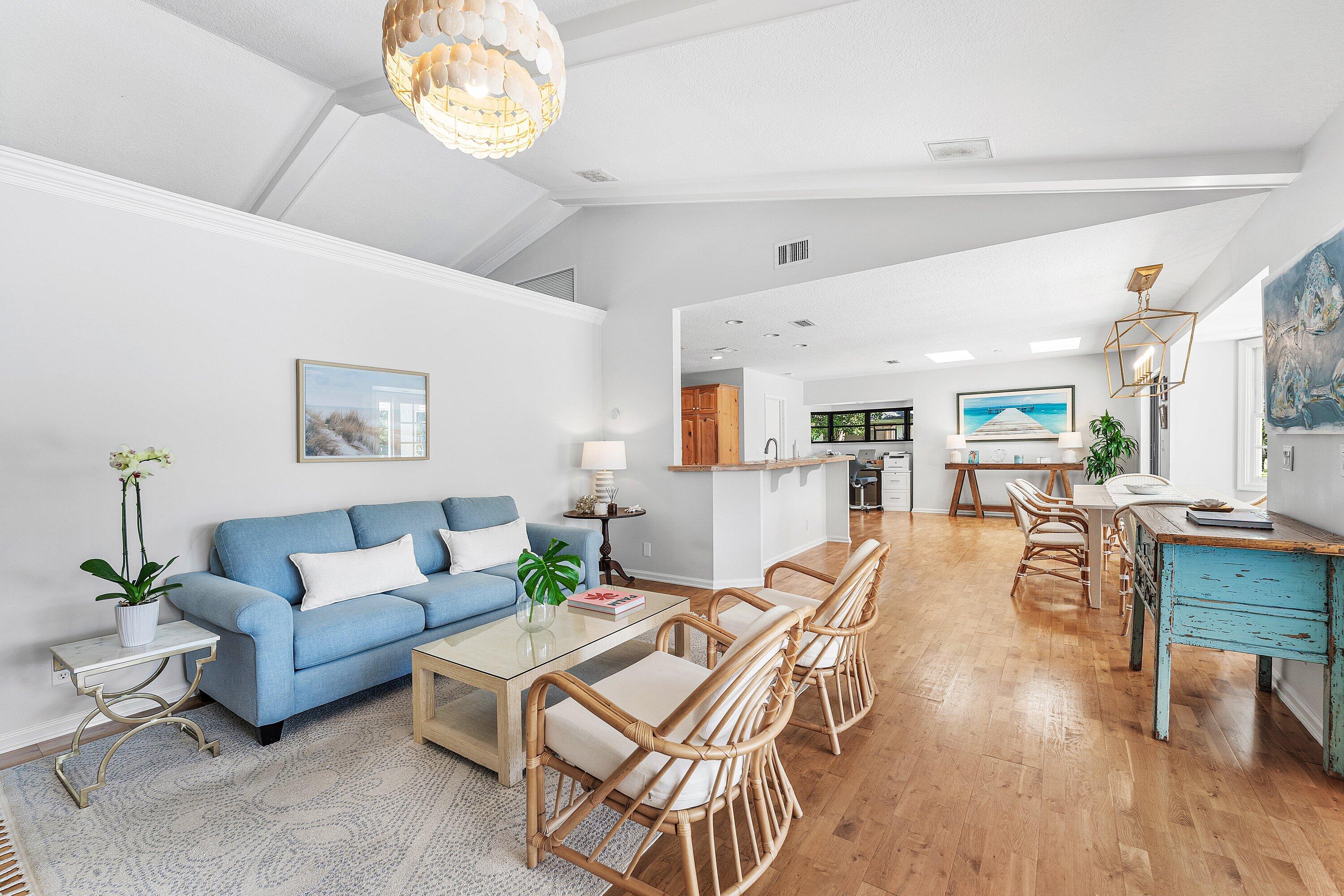 6048 Wood Lake Road Jupiter, FL 33458 - Photo 6 of 31 a living room with furniture and a wooden floor