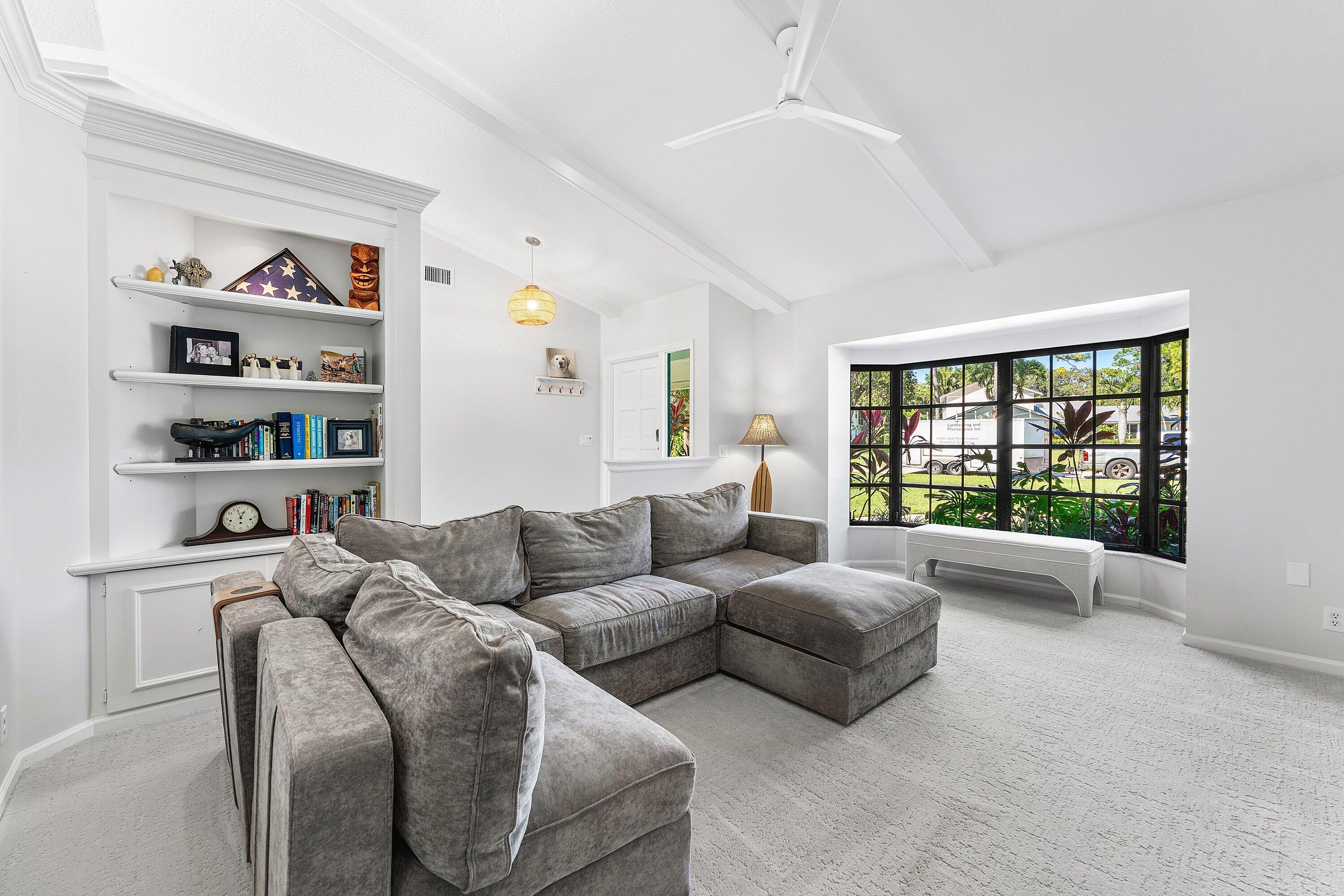 6048 Wood Lake Road Jupiter, FL 33458 - Photo 8 of 31 a living room with furniture and a window