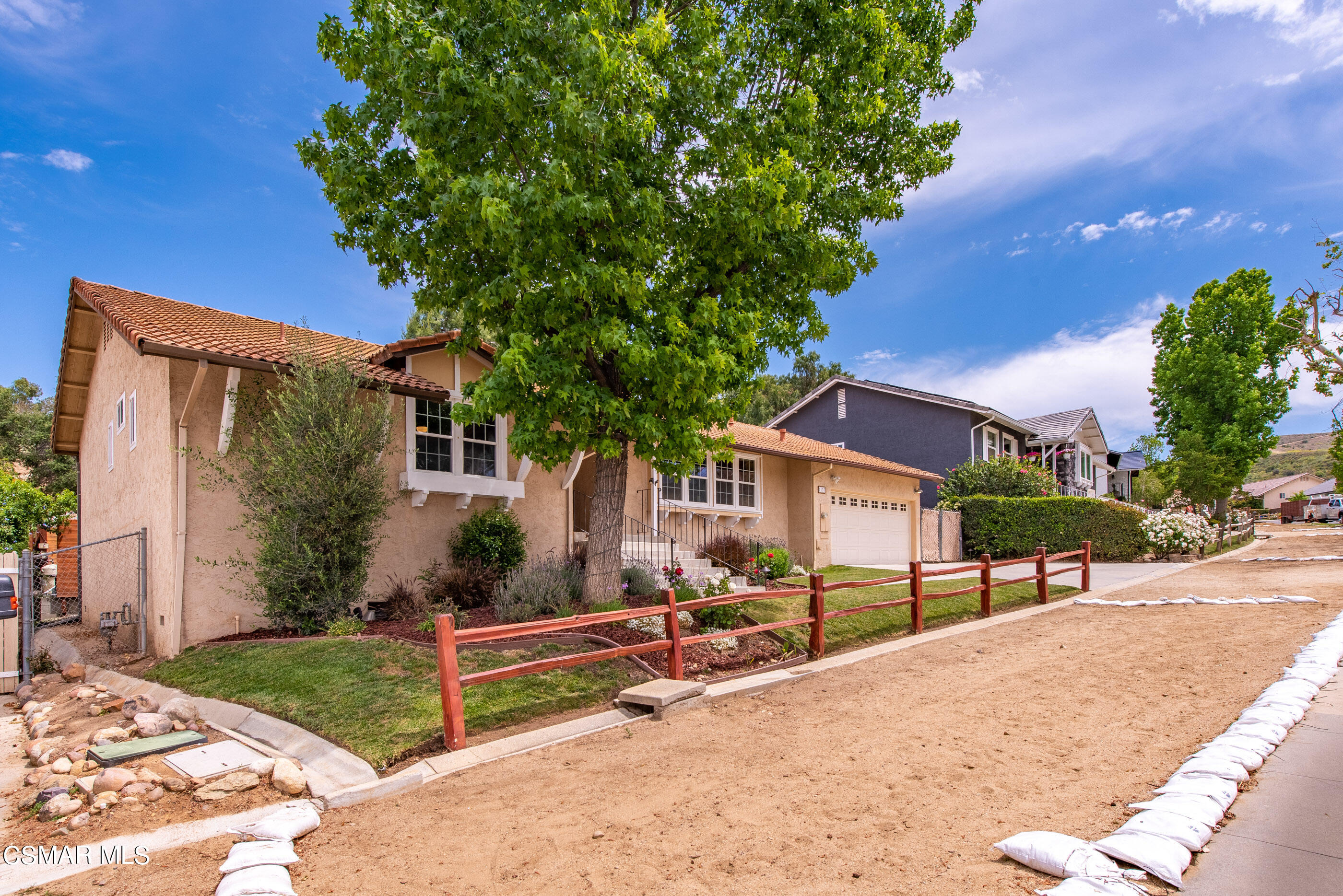 1137 Rambling Road Simi Valley, CA 93065 - Photo 3 of 77 a view of a house with backyard and a tree