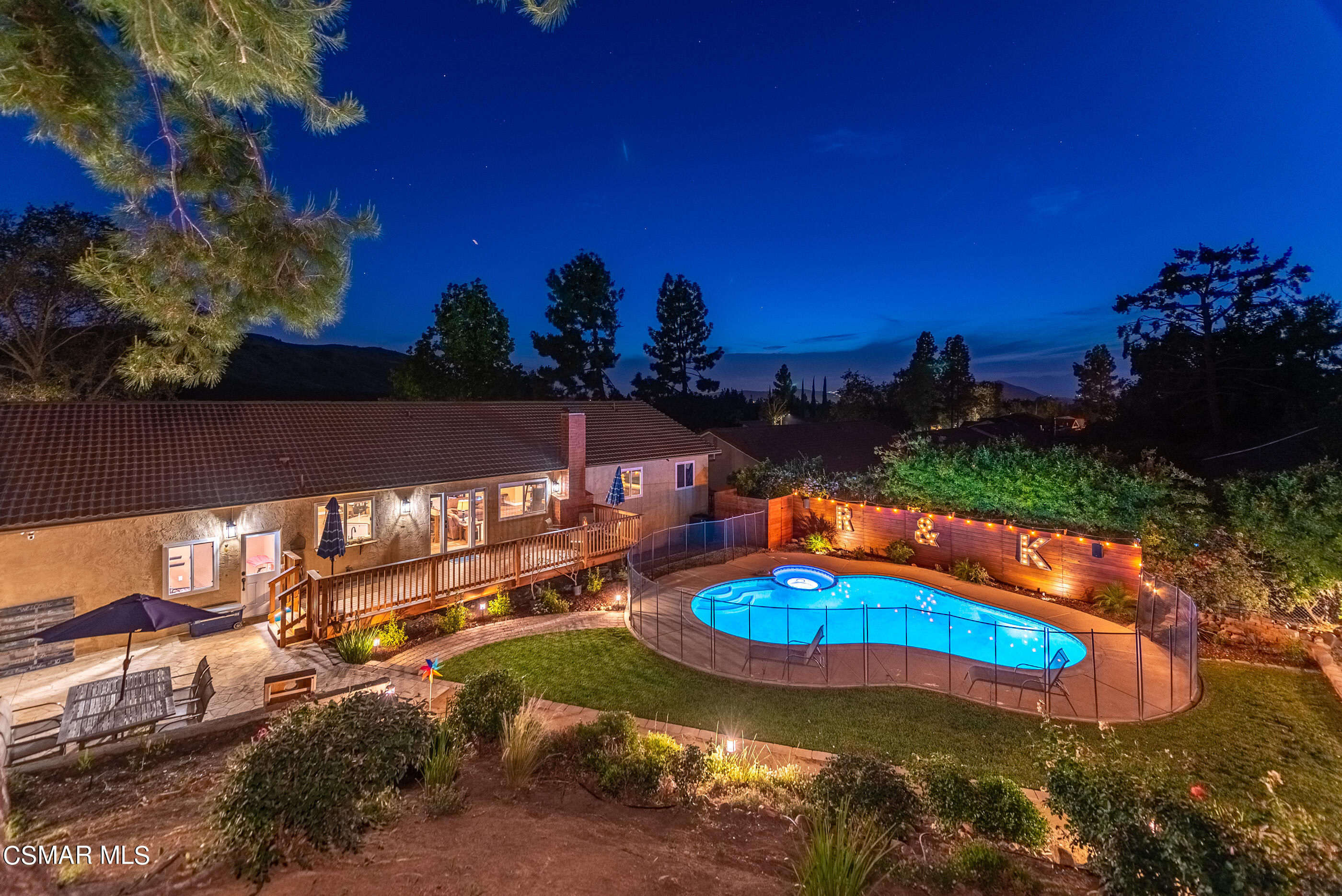 1137 Rambling Road Simi Valley, CA 93065 - Photo 66 of 77 a view of a swimming pool with an outdoor space and seating area