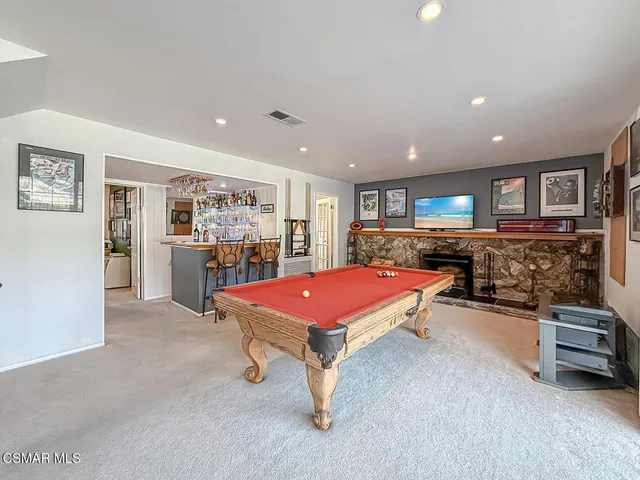 a room with furniture and a flat screen tv