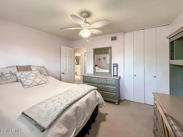 a bathroom with a sink vanity and a mirror