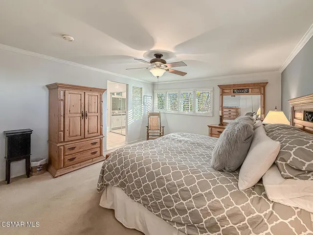 a large white kitchen with a large window