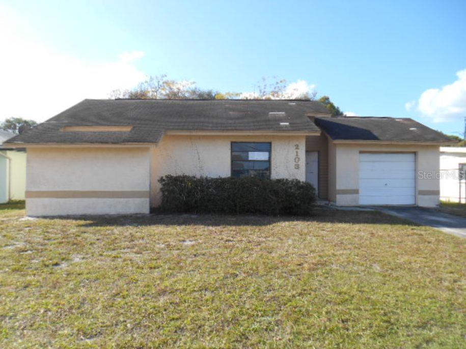 2103 Arcadia Road Holiday, FL 34690 - Photo 1 of 1 a house that has a lot of windows in it