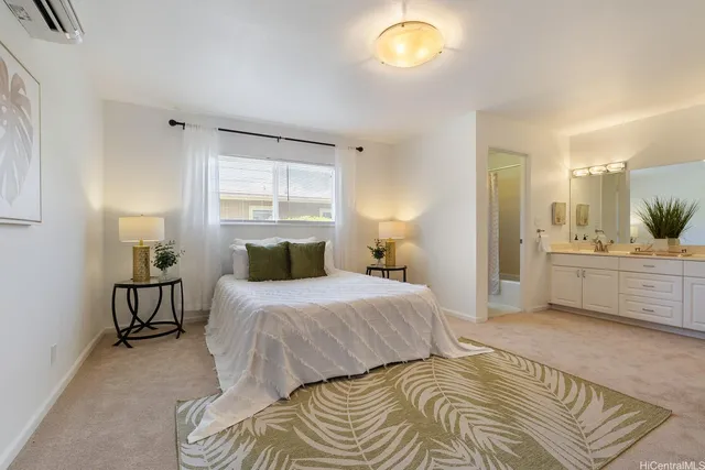 a bedroom with a bed and a cabinets