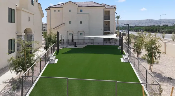 a view of backyard with furniture and window