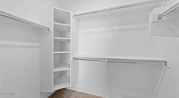 a view of an empty walk in closet
