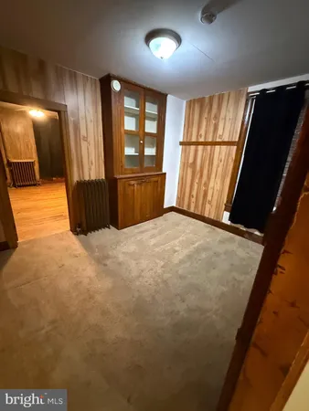 a view of a livingroom with furniture and a kitchen