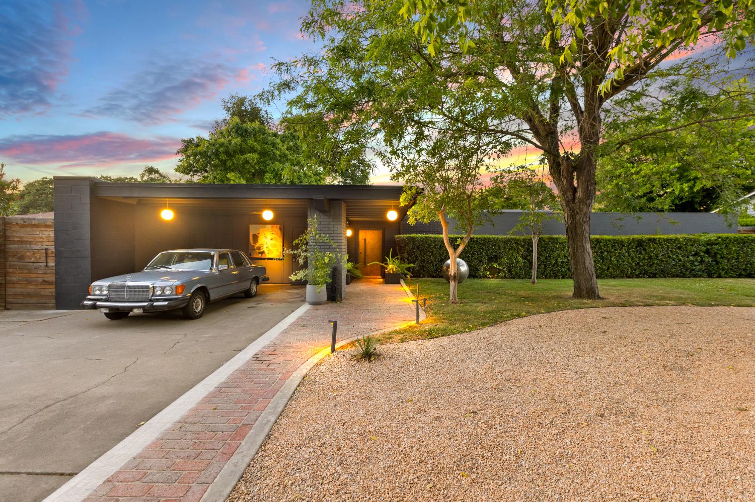 a view of a patio with a table and chairs under an umbrella