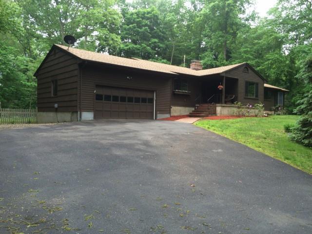 25 Quarry Ridge Road Monroe, CT 06468 - Photo 1 of 1 a front view of house with yard and trees in the background