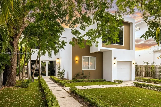 a front view of a house with a yard