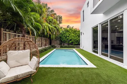 a view of swimming pool with patio and yard