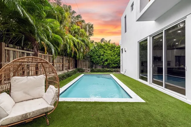 a view of swimming pool with patio and yard