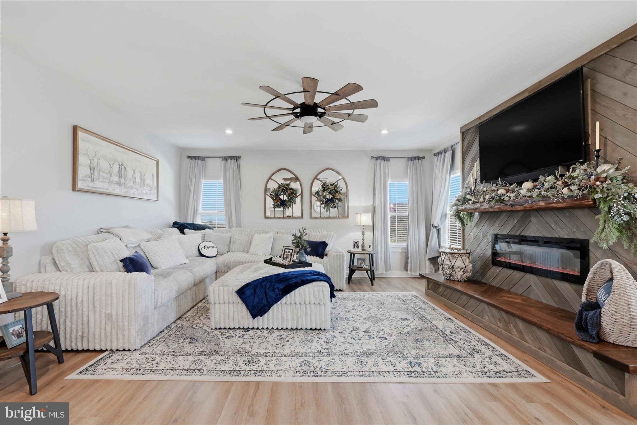 111 Decatur Circle Stephens City, VA 22655 - Photo 12 of 70 a living room with fireplace furniture and a flat screen tv