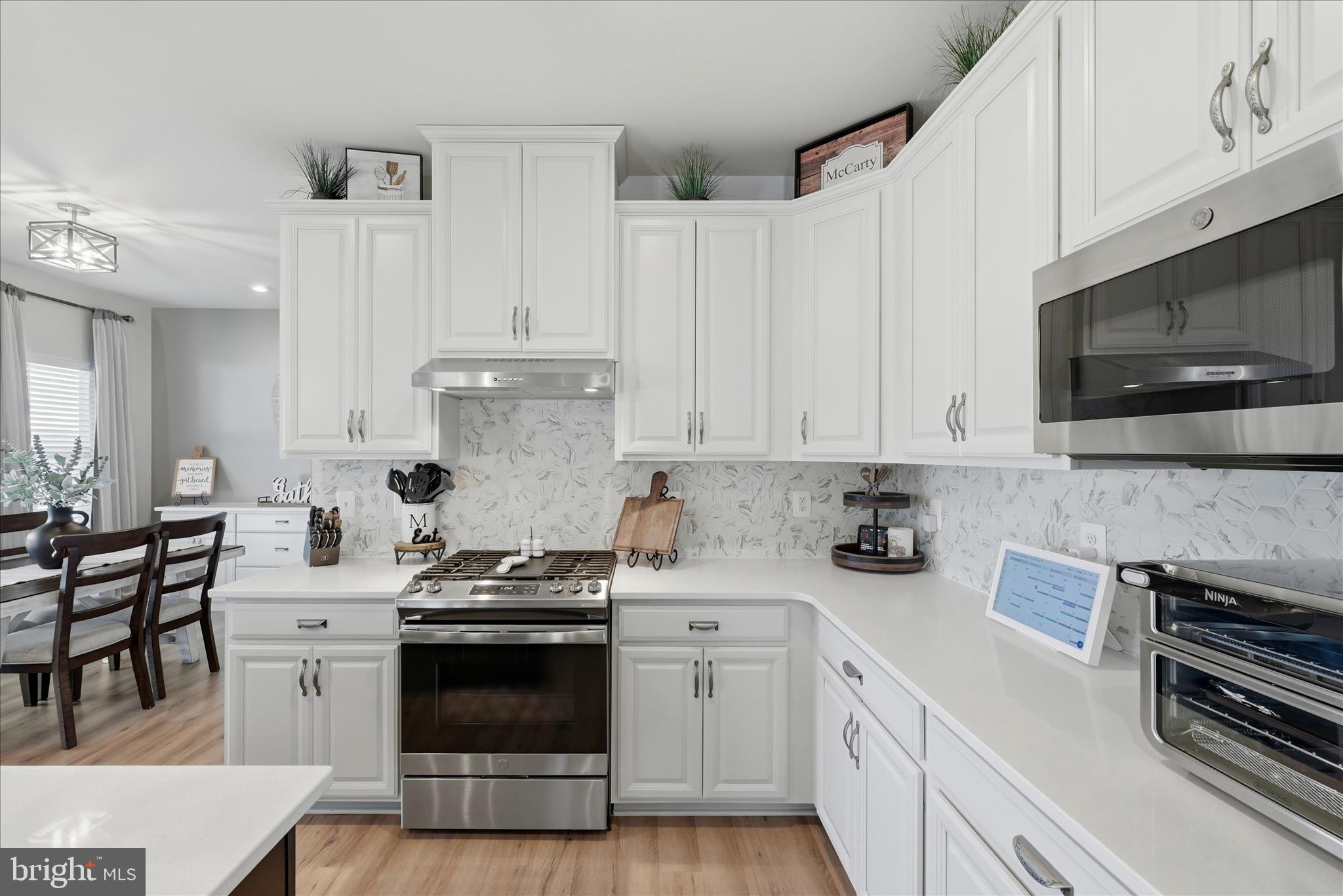 111 Decatur Circle Stephens City, VA 22655 - Photo 16 of 70 a kitchen with cabinets appliances a sink and a counter space
