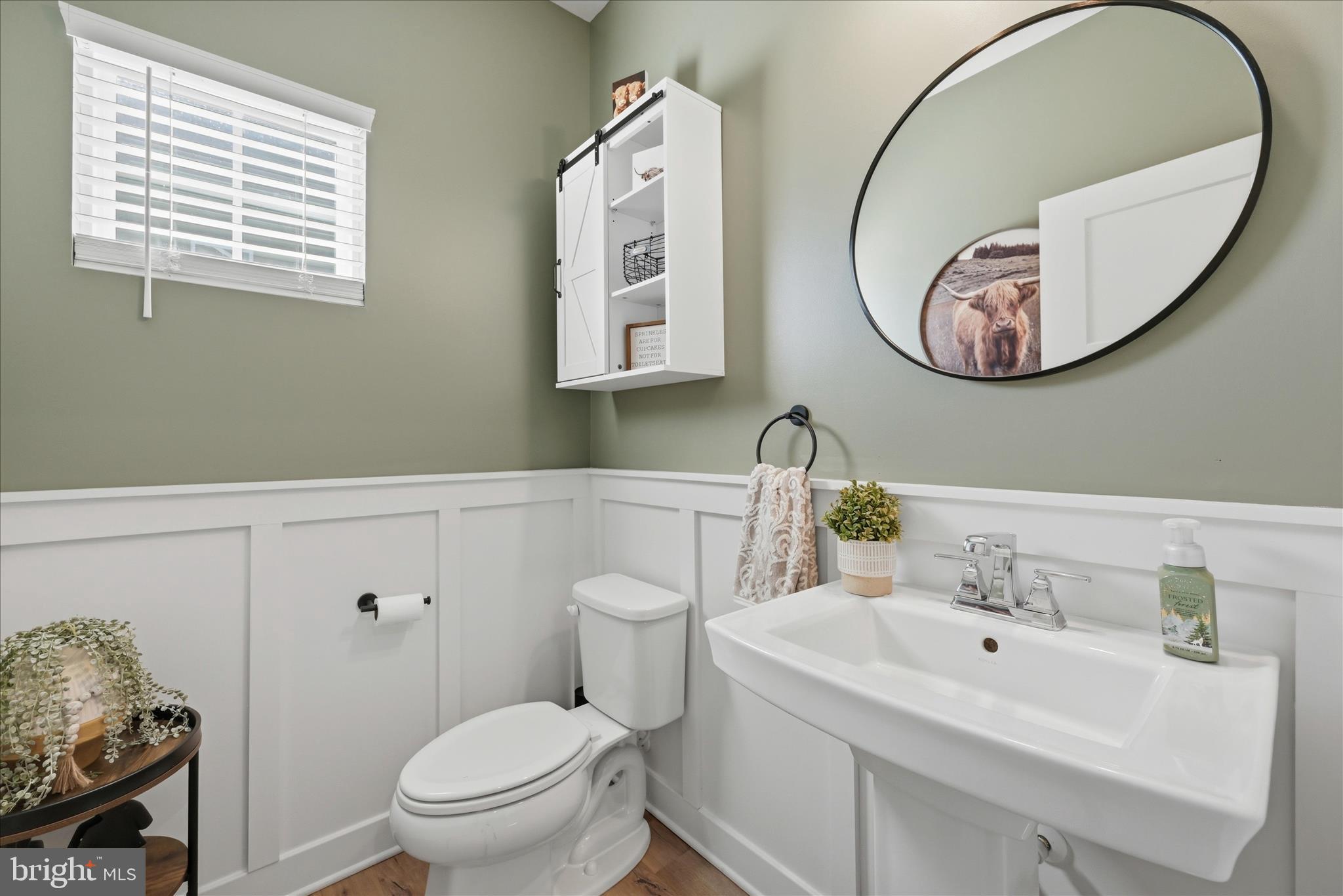 111 Decatur Circle Stephens City, VA 22655 - Photo 24 of 70 a bathroom with a sink a mirror a toilet and a window