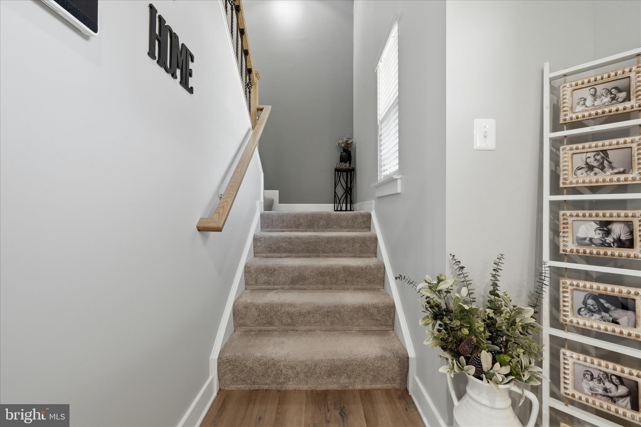 111 Decatur Circle Stephens City, VA 22655 - Photo 25 of 70 a view of staircase with lots of frames on wall and stairs