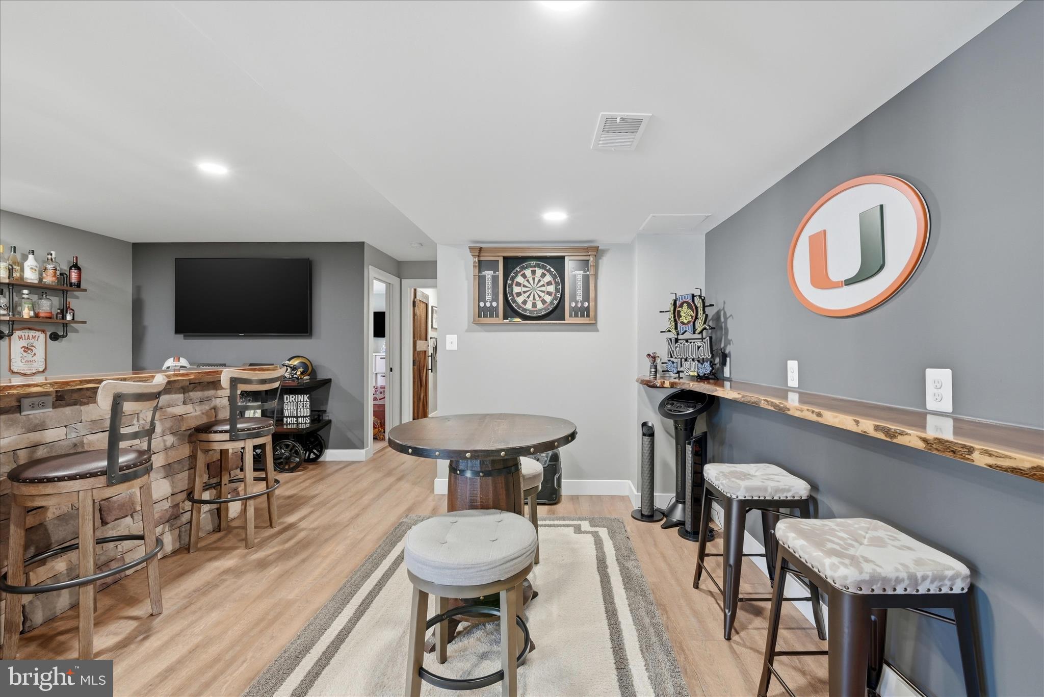 111 Decatur Circle Stephens City, VA 22655 - Photo 51 of 70 a living room with furniture a flat screen tv and kitchen view