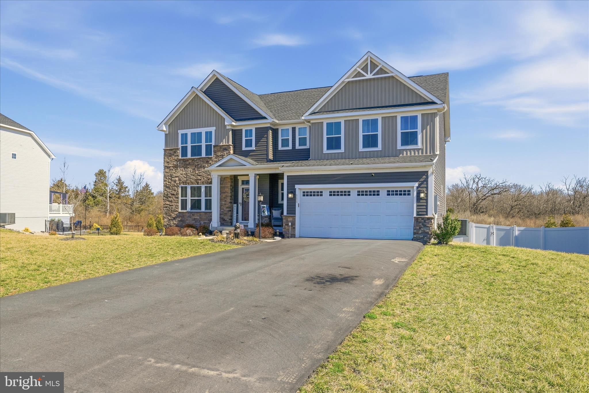 111 Decatur Circle Stephens City, VA 22655 - Photo 66 of 70 a front view of a house with a yard and garage