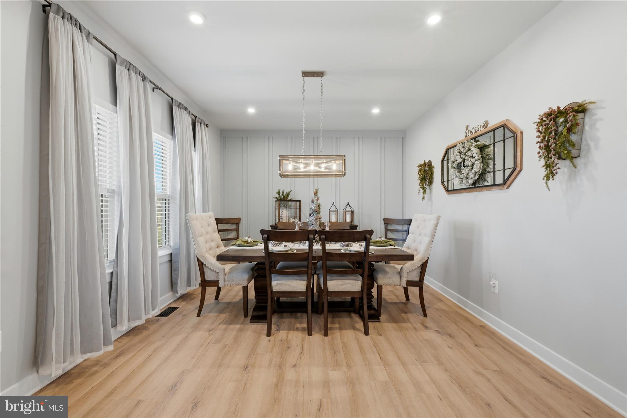111 Decatur Circle Stephens City, VA 22655 - Photo 10 of 70 a view of a dining room with furniture and wooden floor