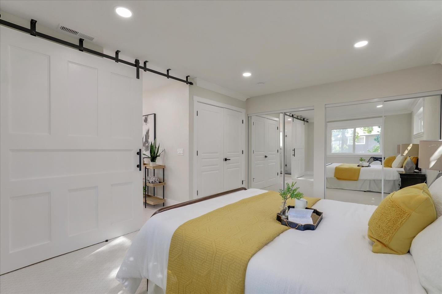 320 Ethan Court San Ramon, CA 94583 - Photo 22 of 46 a spacious bedroom with a bed and a couch