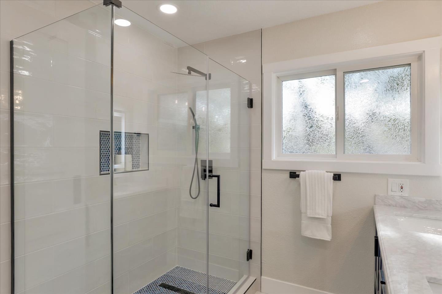 320 Ethan Court San Ramon, CA 94583 - Photo 25 of 46 a bathroom with a glass shower door