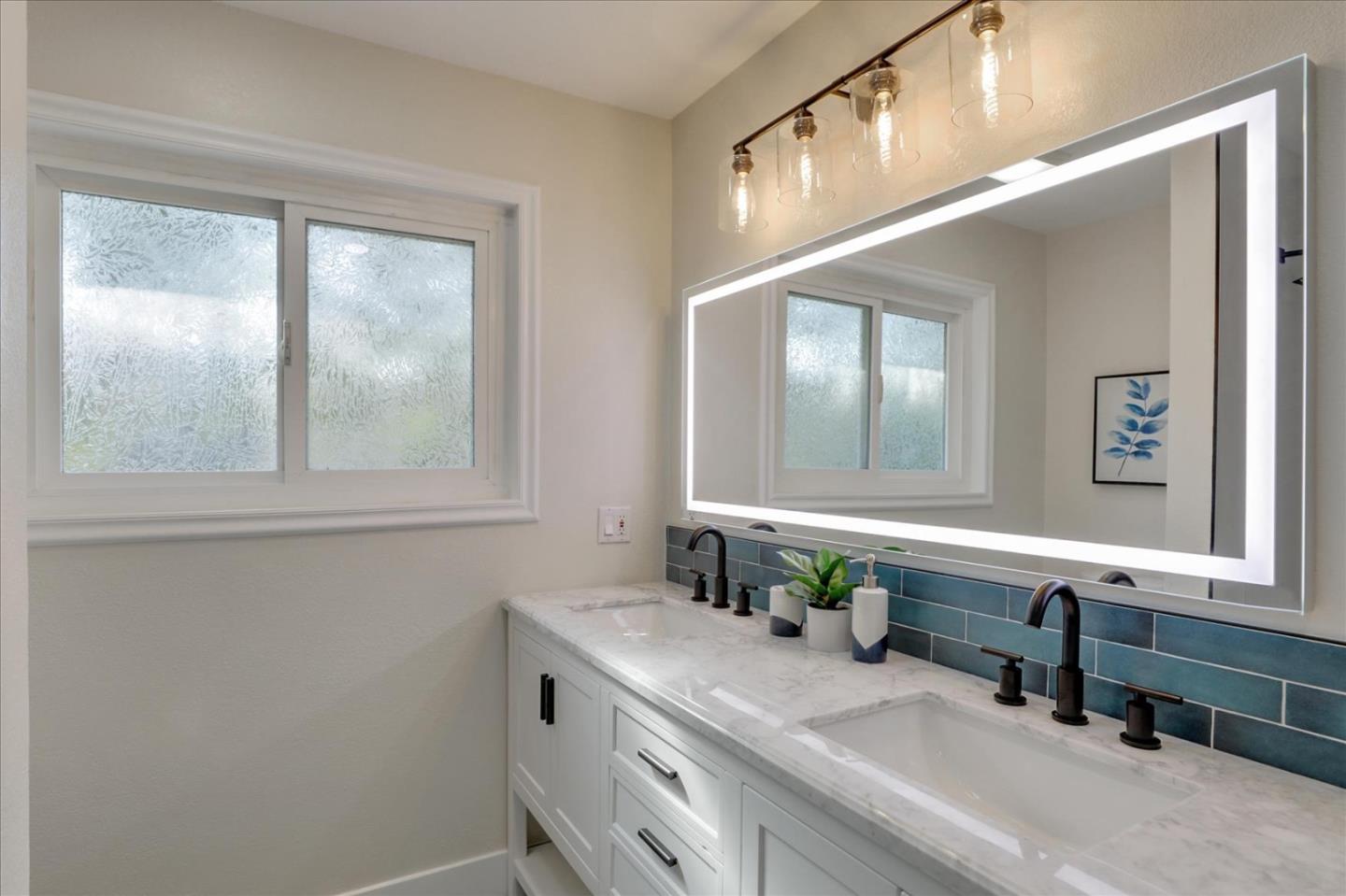 320 Ethan Court San Ramon, CA 94583 - Photo 31 of 46 a bathroom with a double vanity sink window and a mirror