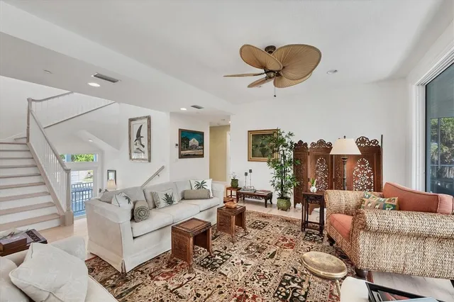 a view of a porch with chairs and a potted plant