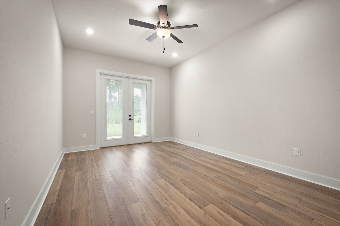 36199 Pitch Lane Hilliard, FL 32046 - Photo 12 of 40 wooden floor in an empty room with a window