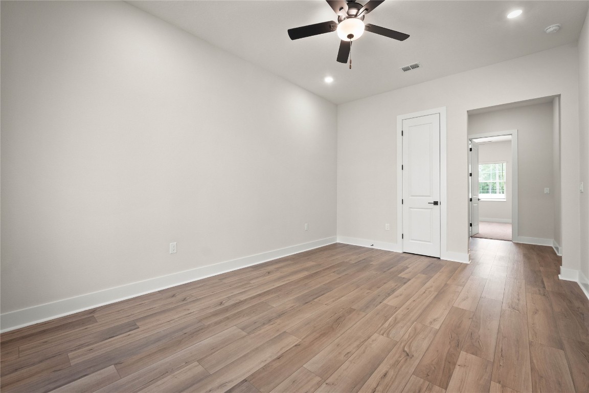 36199 Pitch Lane Hilliard, FL 32046 - Photo 13 of 40 an empty room with wooden floor and windows