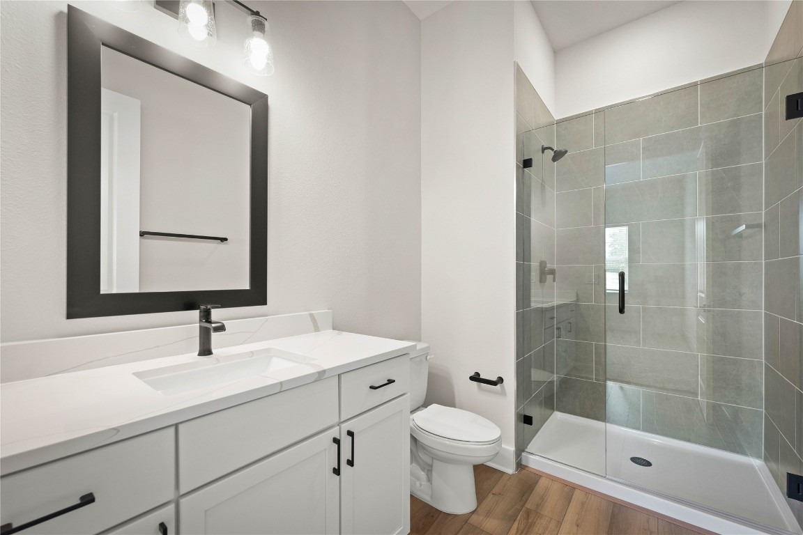 36199 Pitch Lane Hilliard, FL 32046 - Photo 16 of 40 a bathroom with a sink a toilet and shower