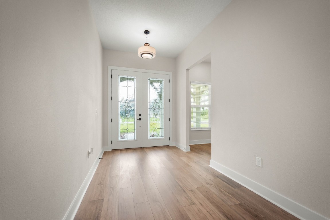 36199 Pitch Lane Hilliard, FL 32046 - Photo 18 of 40 wooden floor in an empty room with a window