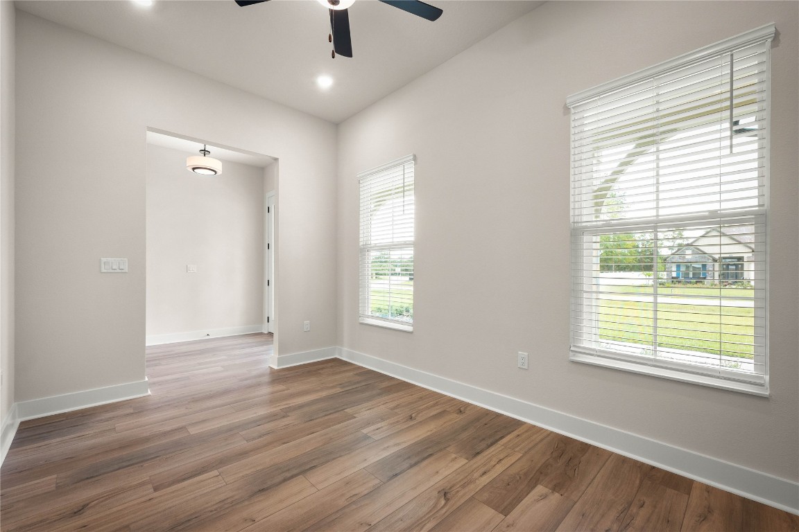 36199 Pitch Lane Hilliard, FL 32046 - Photo 19 of 40 a view of an empty room with wooden floor and a window