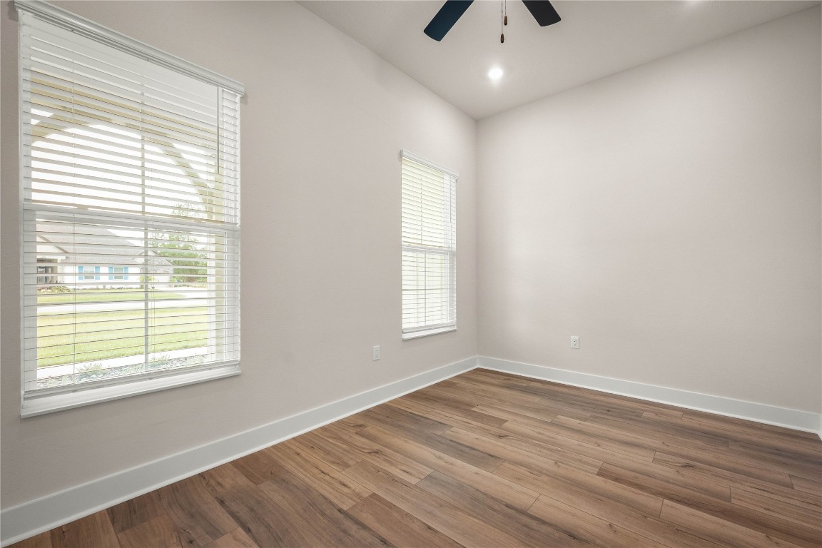 36199 Pitch Lane Hilliard, FL 32046 - Photo 20 of 40 a view of an empty room with wooden floor and a window