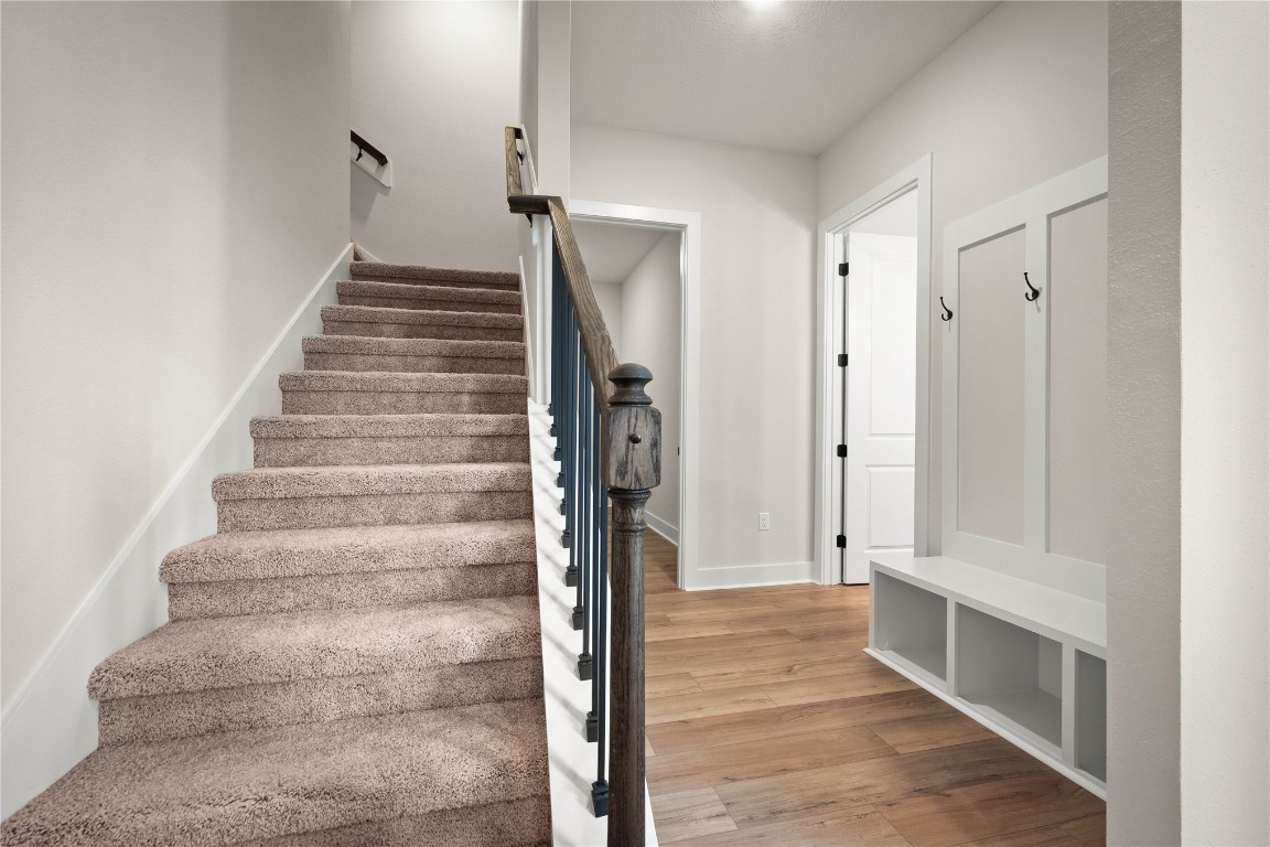 36199 Pitch Lane Hilliard, FL 32046 - Photo 26 of 40 a view of an entryway with wooden floor and a front door